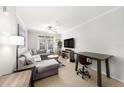 Bright living room with tile floors, neutral walls, modern furniture, and natural light at 4221 W Spruce St # 2104, Tampa, FL 33607