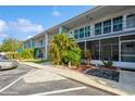 Well-maintained condominium building with lush landscaping and ample parking for residents and guests at 4325 58Th N Way # 1527, Kenneth City, FL 33709