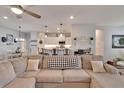 Comfortable seating area flows into a bright and open kitchen space at 4435 Devinshire Fields Loop, Plant City, FL 33567