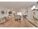 Spacious living room with wood floors, comfortable seating, and an open floor plan at 4435 Devinshire Fields Loop, Plant City, FL 33567