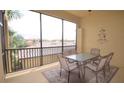 Screened-in patio featuring outdoor seating with a table and seating for six at 6715 Grand Estuary Trl # 203, Bradenton, FL 34212