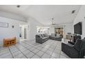 Open-concept living room featuring tile floors and lots of space at 7330 Fairwood Ave, New Port Richey, FL 34653