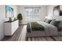 Serene bedroom featuring a neutral color palette, a large window, and wood-look floors at 10356 Carrollwood Ln # 204, Tampa, FL 33618