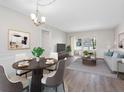 Bright living and dining area featuring modern decor and sliding glass doors to an outdoor space at 10356 Carrollwood Ln # 204, Tampa, FL 33618