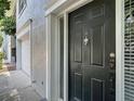 Stylish front door features sidelight window and modern hardware, creating a secure entrance at 1211 W Horatio St # A, Tampa, FL 33606