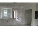 Bright, airy interior showing drywall installed and ready for the next phase of construction at 13009 Ridgely Cir, Port Charlotte, FL 33981
