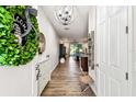 Bright foyer with hardwood floors leading to an open floor plan at 1962 Marlington Way, Clearwater, FL 33763