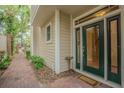 Inviting entrance with brick walkway leading to a green double door entrance at 350 2Nd N St # 1, St Petersburg, FL 33701