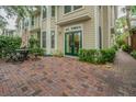 Lovely brick patio with wrought iron table and chairs surrounded by manicured greenery at 350 2Nd N St # 1, St Petersburg, FL 33701