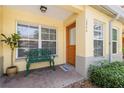 Inviting home exterior with a comfortable bench and welcoming front door at 3866 Mariner Dr, St Petersburg, FL 33705