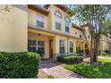 Charming townhome featuring a manicured lawn and inviting front porch at 3866 Mariner Dr, St Petersburg, FL 33705