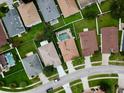 Aerial view of a residential neighborhood showcasing well-maintained homes with green lawns and mature trees at 4535 Gateway Blvd, Wesley Chapel, FL 33544