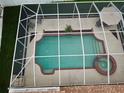 Aerial shot of a screened in private pool and spa showcasing its outdoor leisure features at 4535 Gateway Blvd, Wesley Chapel, FL 33544