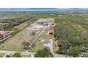 Expansive property featuring a house, pond, barns, and lots of land perfect for farming or recreational activities at 5012 Troydale Rd, Tampa, FL 33615