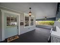 Charming front porch featuring painted accents, a ceiling fan, and an open layout at 5301 N Central Ave, Tampa, FL 33603