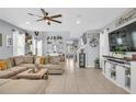 Spacious living room with neutral tones, tile flooring, and stylish decor at 7238 Milestone Dr, Apollo Beach, FL 33572