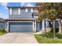 Beautiful two-story home featuring a two-car garage and well-manicured lawn at 10808 Whitecap Dr, Riverview, FL 33579