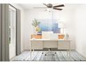 Bright office with a modern desk, stylish decor, and a comfortable workspace at 12442 Radiant Crystal Rose, Parrish, FL 34219