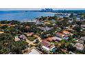 Panoramic aerial view showcasing waterfront property, the city skyline, and luxury residential neighborhood at 132 Giralda Ne Blvd, St Petersburg, FL 33704