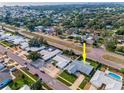 Aerial view of home showcasing proximity to roads and neighborhood at 14341 Passage Way, Seminole, FL 33776