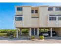 Charming two-story townhouse with garage and covered parking underneath, situated close to nature at 1500 Sunset Rd # C10, Tarpon Springs, FL 34689