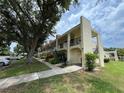 Condominium building featuring sidewalks and allocated resident parking at 2295 Mexican Way # 41, Clearwater, FL 33763