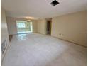 Bright living room ready for renovation, offering great space for entertaining at 3035 Coldwell Dr, Holiday, FL 34691