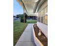 Covered walkway with deer ornaments at 33516 Arthur Dr, Wesley Chapel, FL 33543