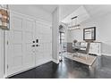 Inviting entryway leading into a dining area with elegant decor, featuring modern lighting and stylish furnishings at 8638 Chadwick Dr, Tampa, FL 33635