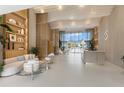 Bright lobby features modern decor, comfortable seating, and access to outdoor amenities at 1020 Sunset Point Rd # 410, Clearwater, FL 33756