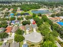 Aerial shot showcasing the property's location within a residential neighborhood near a pond at 11726 S Stone Ln, Riverview, FL 33569