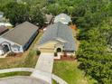 An elevated perspective of the home, highlighting its roof and surrounding greenery at 11726 S Stone Ln, Riverview, FL 33569