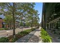 Street view of shops with sidewalks, trees, and road that creates a lively community atmosphere at 1805 W Jetton Ave, Tampa, FL 33606