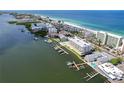 Stunning aerial view of waterfront property with private docks, intercoastal waterway, and beach access at 20019 Gulf Blvd # 1, Indian Shores, FL 33785