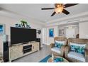 Relaxing living room showcasing a coastal design, tile flooring, and comfortable seating at 223 Island Way # 7F, Clearwater Beach, FL 33767