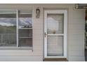 Inviting front door with gold hardware and sidelight window provides natural light at 2441 Persian Dr # 61, Clearwater, FL 33763