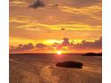 Breathtaking sunset over the water, creating a serene and picturesque scene at 2700 Bayshore Blvd # 11405, Dunedin, FL 34698