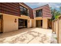 Enclosed courtyard featuring dual sliding glass doors and two small balconies at 2725 11Th Ct, Palm Harbor, FL 34684