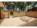 The back patio features a privacy fence and a small patch of grass at 2725 11Th Ct, Palm Harbor, FL 34684