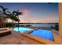 Inviting outdoor pool with waterfront views perfect for relaxation and entertaining at 301 Bayview Ne Dr, St Petersburg, FL 33704