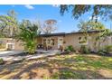 Inviting home featuring a well-manicured front yard, fresh landscaping, and charming curb appeal at 310 55Th S Ave, St Petersburg, FL 33705