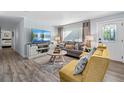 Bright living room featuring stylish furnishings, hardwood floors, and ample natural light at 3485 Floral Dr, Largo, FL 33771
