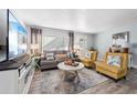 Inviting living room with comfortable seating, modern decor, and abundant natural light at 3485 Floral Dr, Largo, FL 33771