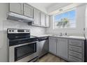 Updated kitchen boasts stainless appliances and gray cabinets at 3580 38Th S Ave # 95, St Petersburg, FL 33711