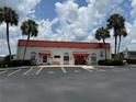 Community center with palm trees, sidewalks and ample parking spaces at 37832 Madeira Ave, Zephyrhills, FL 33541