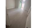 Bright bedroom featuring tiled floors and sliding glass doors to the outdoors at 4208 W Carmen St # C, Tampa, FL 33609