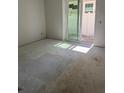 Unfinished room featuring a sliding glass door leading to a backyard area at 4208 W Carmen St # C, Tampa, FL 33609