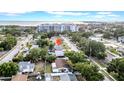 An aerial view showcasing the property's location with nearby buildings and ocean view at 4726 W Fairview Hts, Tampa, FL 33616