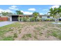 Charming single-story home with a well-manicured lawn and mature landscaping, offering great curb appeal at 4726 W Fairview Hts, Tampa, FL 33616