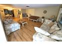 Spacious living room featuring hardwood floors and plenty of seating at 5031 Billings Dr, Holiday, FL 34690